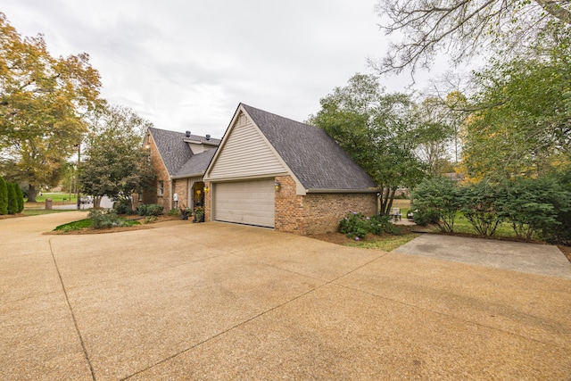 view of side of home featuring a garage