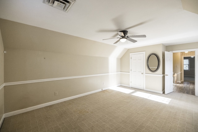 bonus room with ceiling fan, carpet floors, and lofted ceiling