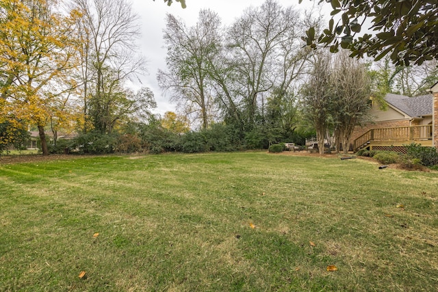 view of yard with a wooden deck