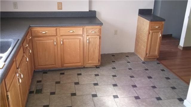 kitchen with hardwood / wood-style floors