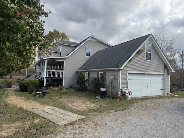 view of front of house with covered porch and a garage