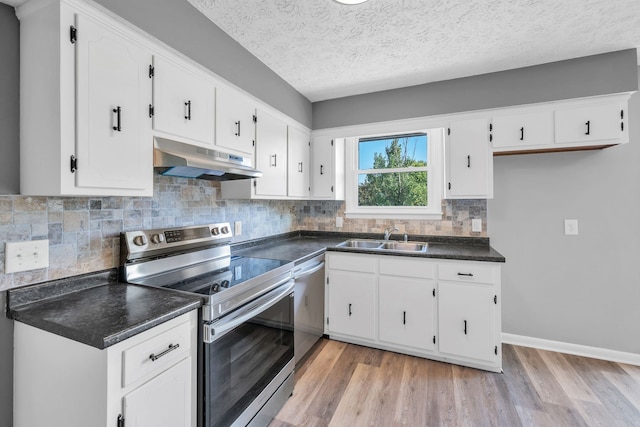 kitchen featuring white cabinetry, sink, light wood-type flooring, and appliances with stainless steel finishes