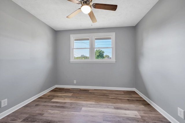 unfurnished room with wood-type flooring, a textured ceiling, and ceiling fan