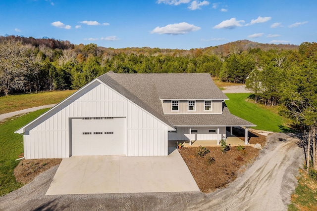 view of front of house featuring a garage and covered porch