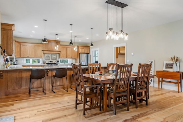 dining area featuring light wood-type flooring