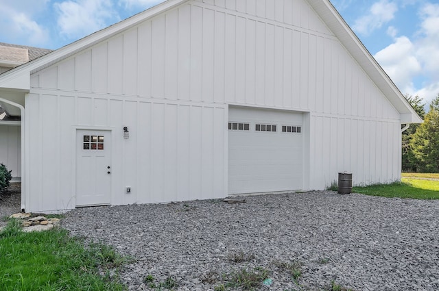 view of side of property with a garage and an outdoor structure