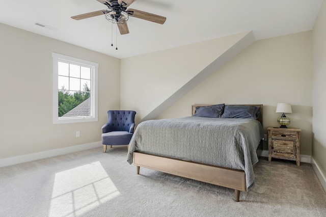 bedroom featuring carpet, vaulted ceiling, and ceiling fan