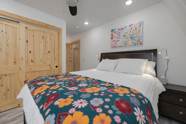 bedroom with ceiling fan and hardwood / wood-style floors