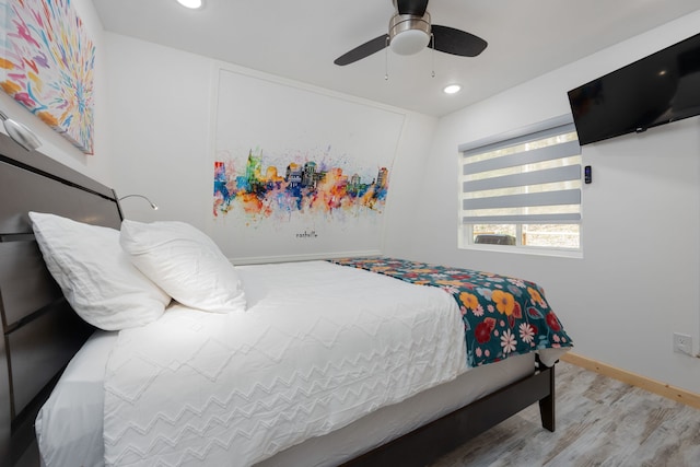 bedroom featuring light hardwood / wood-style flooring and ceiling fan