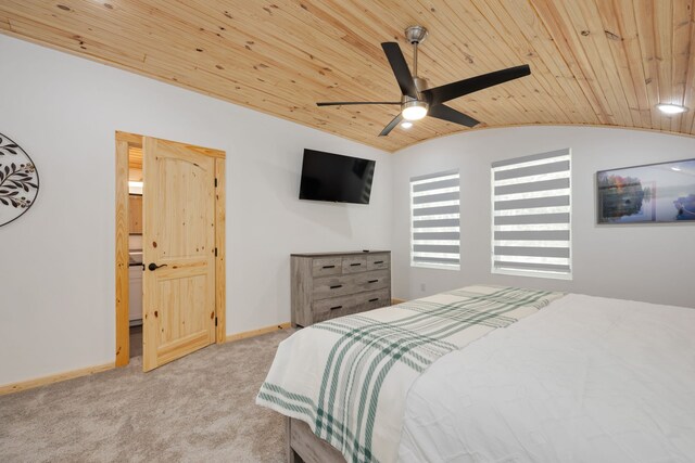 carpeted bedroom featuring vaulted ceiling, ceiling fan, and wood ceiling