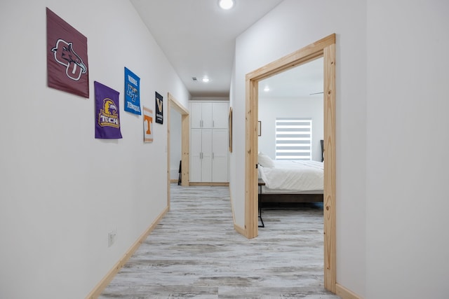 hallway featuring light hardwood / wood-style flooring