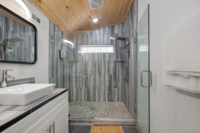 bathroom with vanity, an enclosed shower, wood ceiling, and vaulted ceiling