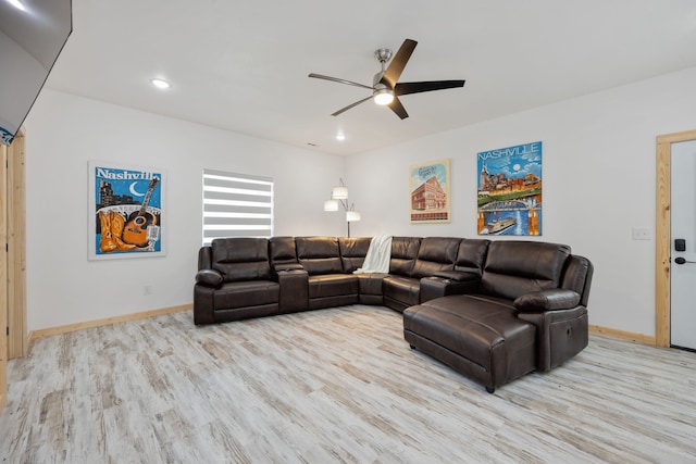 living room with ceiling fan and light wood-type flooring