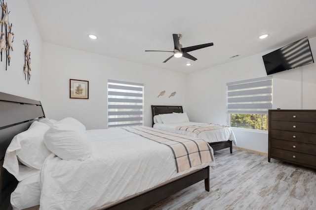 bedroom featuring ceiling fan and light hardwood / wood-style flooring