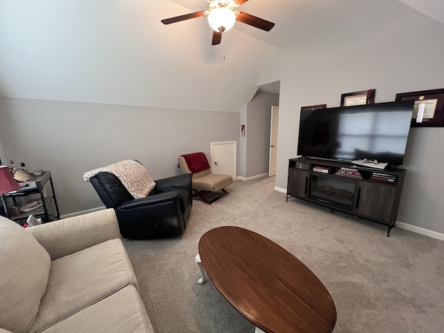 carpeted living room with vaulted ceiling and ceiling fan