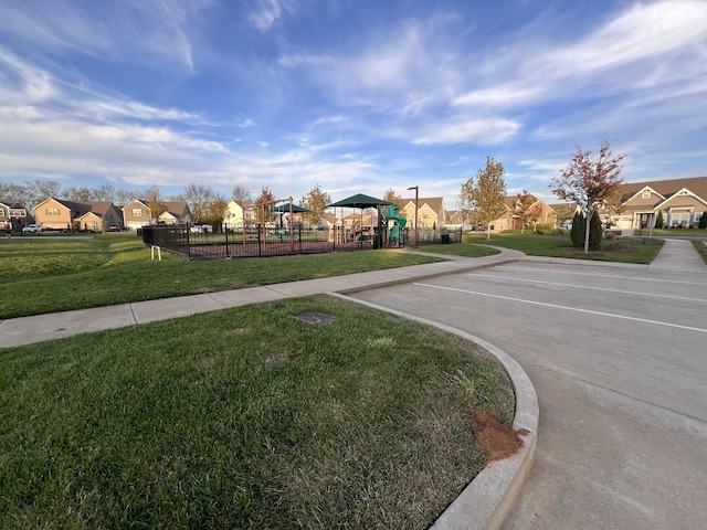 exterior space with a playground and a yard