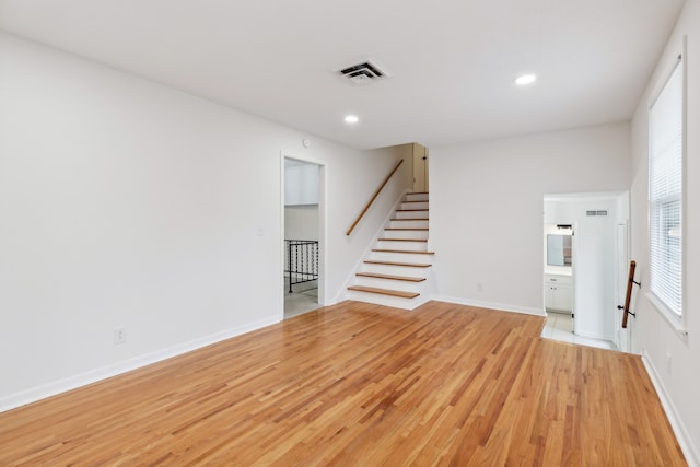 unfurnished living room with light hardwood / wood-style floors