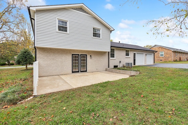 back of property featuring a patio, central AC unit, and a lawn