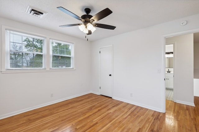 unfurnished bedroom featuring ceiling fan and light hardwood / wood-style floors