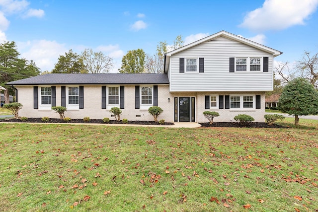 tri-level home featuring a front yard