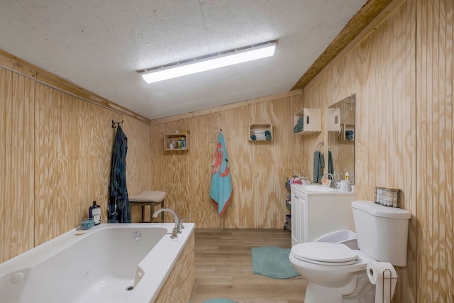 bathroom featuring vanity, wood walls, a bath, vaulted ceiling, and hardwood / wood-style flooring