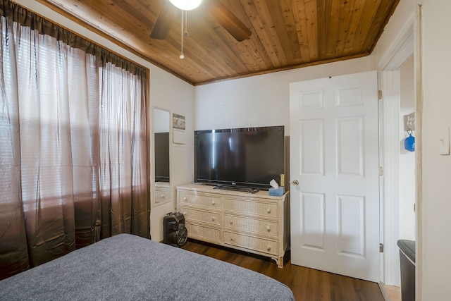 bedroom featuring dark hardwood / wood-style flooring, ceiling fan, crown molding, and wood ceiling