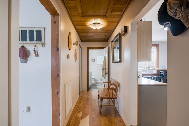 corridor featuring wood ceiling and light hardwood / wood-style floors