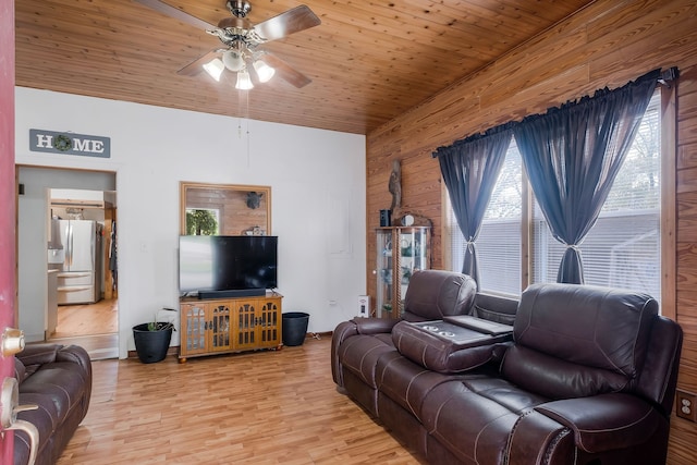 living room with wooden ceiling, wooden walls, ceiling fan, and light hardwood / wood-style floors