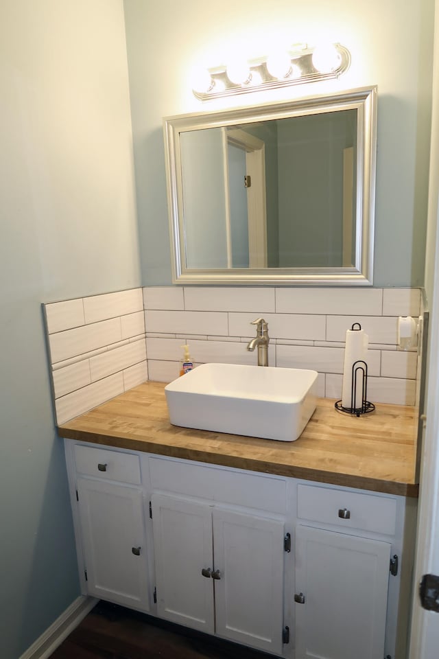 bathroom featuring backsplash and vanity