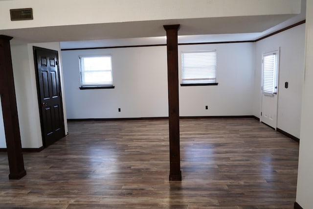 unfurnished room with dark hardwood / wood-style flooring