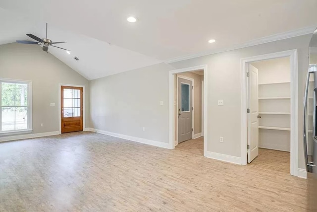 interior space with vaulted ceiling, light hardwood / wood-style flooring, and ceiling fan