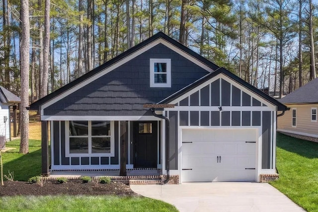 view of front of property with a garage and a front lawn