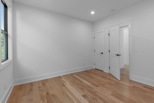 unfurnished room featuring light wood-type flooring