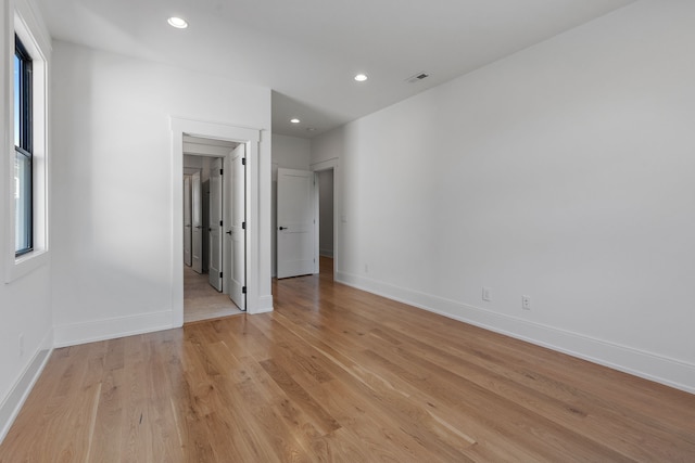 unfurnished bedroom with light wood-type flooring