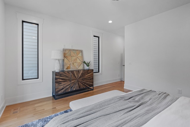 bedroom with hardwood / wood-style floors