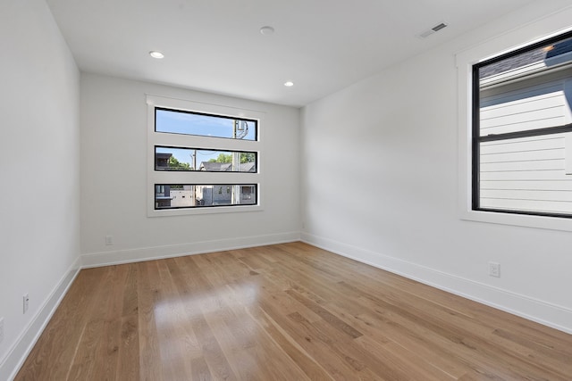 unfurnished room featuring light hardwood / wood-style flooring