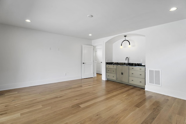 interior space with sink and light hardwood / wood-style floors