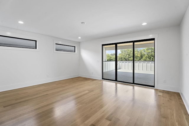 unfurnished room with light hardwood / wood-style floors