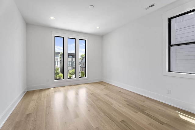 spare room featuring light hardwood / wood-style floors