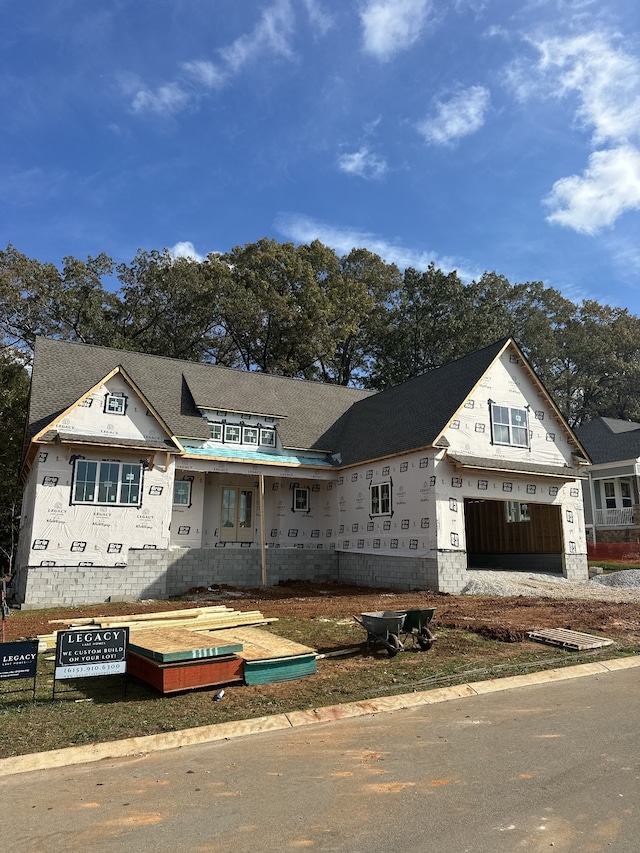 property in mid-construction with a garage