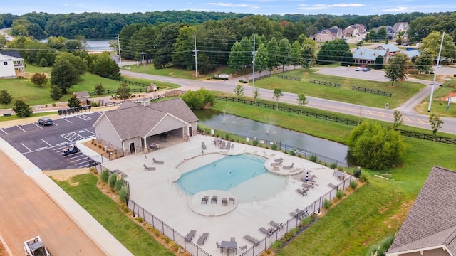 birds eye view of property with a water view