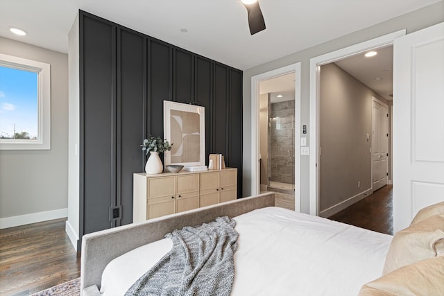 bedroom with connected bathroom, dark hardwood / wood-style floors, and ceiling fan