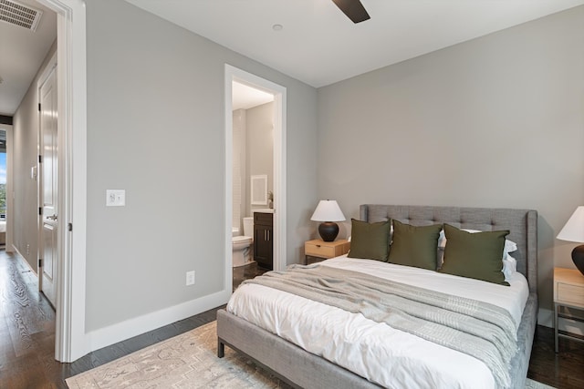 bedroom with hardwood / wood-style floors, ensuite bathroom, and ceiling fan