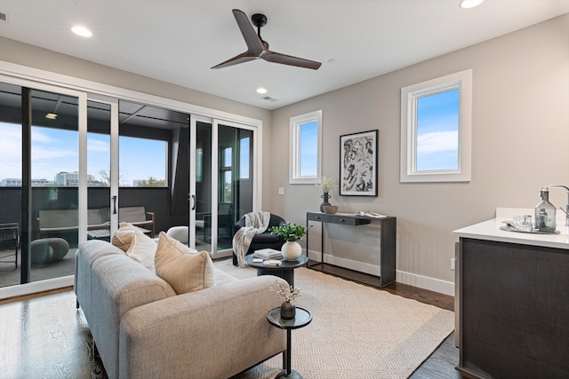 living room featuring dark hardwood / wood-style flooring and plenty of natural light