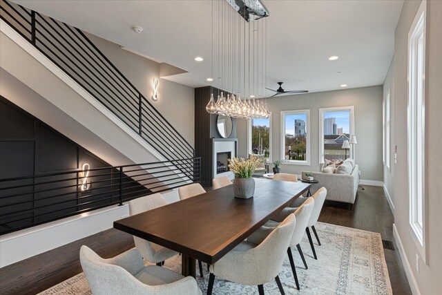 dining room featuring ceiling fan and dark hardwood / wood-style flooring