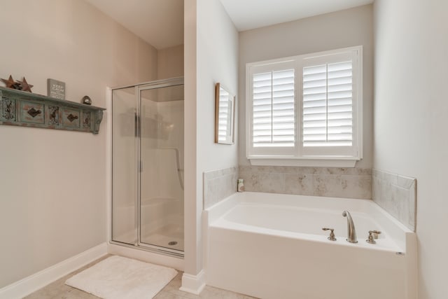 bathroom featuring tile patterned flooring and plus walk in shower