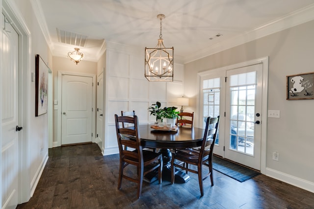 dining space featuring a chandelier, dark wood-type flooring, and ornamental molding