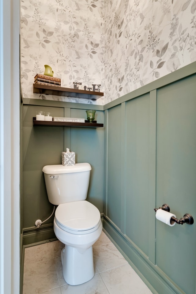 bathroom featuring tile patterned flooring and toilet