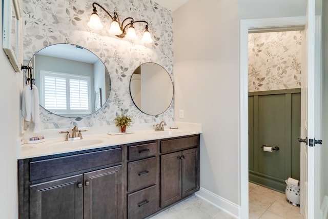 bathroom featuring tile patterned flooring and vanity