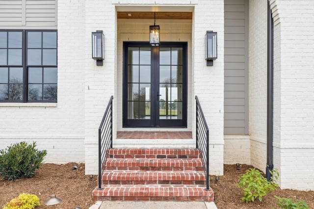 view of exterior entry featuring french doors